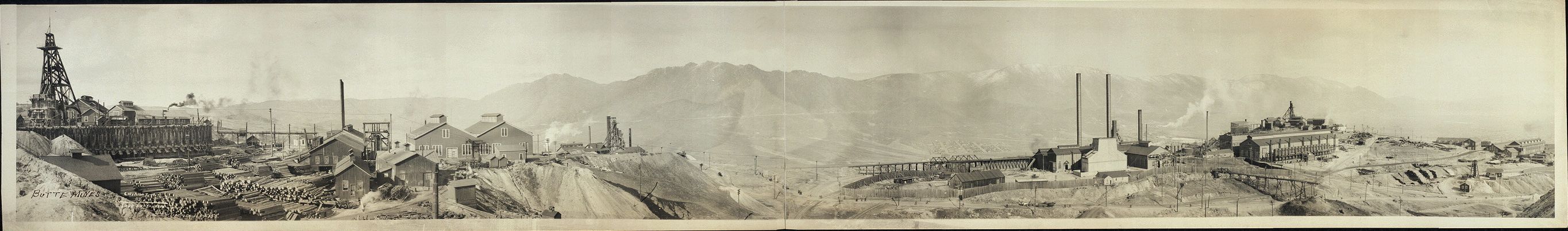 Panorama of the Butte mines, c. 1914: headframes, smokestacks, ore bins and timber yards stretching along the hill