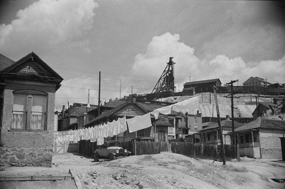 A copper miner’s home with laundry on the line, headframe behind the back fence, 1939